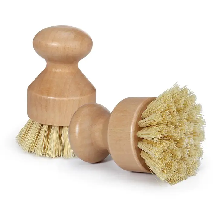 Two natural beechwood pot scrubber brushes with sisal bristles on white background
