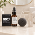 ONYX facial cleansing bar, illuminating facial serum, Luna charcoal sponge and Vanilla Cloud lip butter in a face care kit